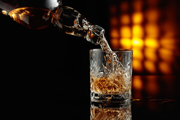 Poster - Pouring whiskey from a bottle into a glass.