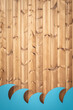 Wooden texture background with blue waves made of cardboard. Summer beach cafe or bar wall decoration. Surfing spot creative design. Ocean, seafood restaurant, seasonal decor concept. Space, vertical 