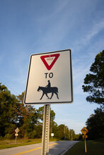 Horse Crossing Warning Sign At The Side Of A Road.