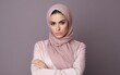 © Vladislava - Portrait of a lovely angry young Arab, Arabic girl wearing hijab, casual clothing standing isolated over pastel pink purple, blue, yellow background, arms folded, ethnic, banner, jealous, AI Generated