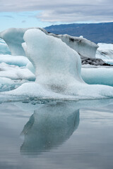 Wall Mural - Close up of glacial ice floating in the Jokulsarlon Glacial Lagoon, Iceland. Showing natural patterns in the ice formations