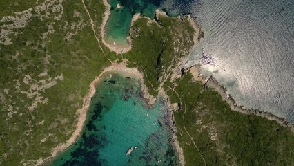 Wall Mural - Stunning aerial perspective of Porto Timoni Beach and its mesmerizing blue turquoise waters on a sunny day in Corfu Island