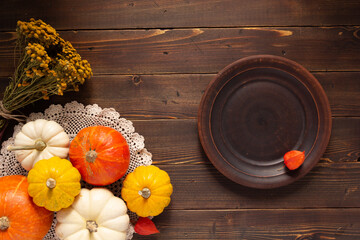 Wall Mural - Dried corn cob at wooden table as autumn still life