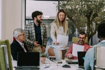 Wall Mural - Four business people talking