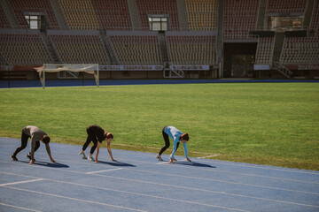 Male and female friends preparing for running