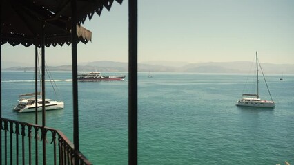 Wall Mural - Video capturing a ferry gracefully sailing past the scenic island of Corfu