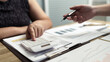 © mojo_cp - Woman Analysis Business Accounting working with Individual income tax return Accounting concept..