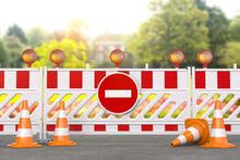Under Construction. Road Barrier With Trafic Signs, Cones And Hard Hat. Ecology And Nature Conservation Concept.