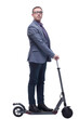 © ASDF - Side view of young modern man using and driving electric isolated over white background