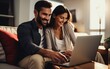 © Liana - This picture portrays a married pair, working side by side, as they carefully devise a family budget and conduct online financial transactions via their laptop.