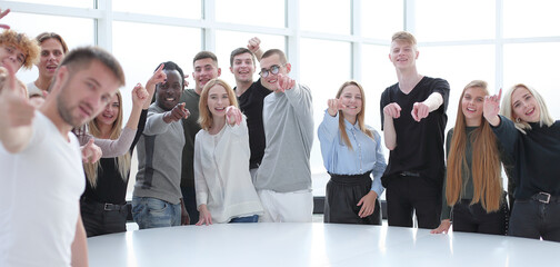 Wall Mural - multinational group of students standing near a round table