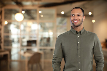 Canvas Print - Portrait of handsome confident man in office, space for text