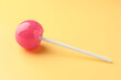 © New Africa - One tasty lollipop on yellow background, closeup