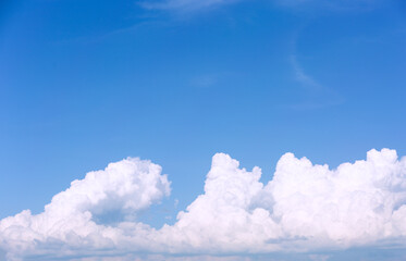 Wall Mural - White clouds on blue sky background.