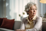 Fototapeta  - Sad thoughtful grey haired woman sitting on sofa at home, looking at window away in deep unhappy thoughts, touching face, suffering from depression, apathy. Generative AI.