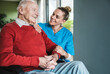 © Westend61 - Happy nurse taking care and supporting senior man at home