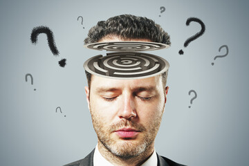Poster - Concept of psychology and human consciousness with man head with labyrinth and question marks on grey background