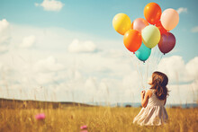 Vintage Photo Of Happy Young Girl Holding Colorful Balloons And Sitting On Grass Field - Generative AI