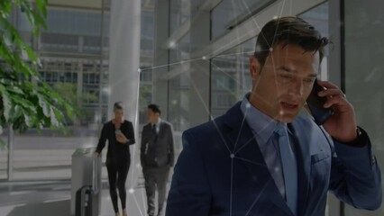Poster - Animation of network of connections against caucasian businessman talking on smartphone at office