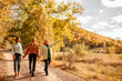 © Вероника Зеленина - Multiracial female people  with different bodies and hairs walking in the fall parks together.  Friends wearing warm fashion clothes, knitted sweaters.