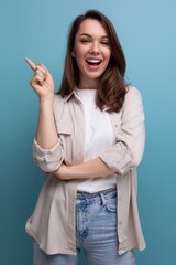 Canvas Print - charming 30s woman with chic black well-groomed hair in a beige shirt