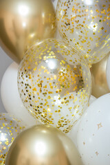 Wall Mural - shiny golden balloons with confetti, big bunch of helium balloons