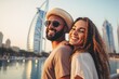 © A Denny Syahputra - multiethnic couple travelling in Dubai. Happy young travelers exploring in city