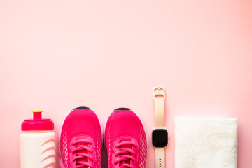 Wall Mural - Workout, healthy lifestyle concept. Sneakers, towel, fitness bbracelet and bottle of water. Flat lay image.