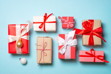 Wall Mural - Christmas presents on blue background. Boxing day concept with holiday decorations. Top view with copy space.