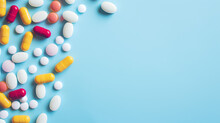 Colorful Medicine Tablets Antibiotic Pills On Soft Blue Background