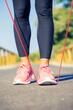 woman leg and skipping rope