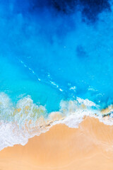 Wall Mural - waves and beach from a drone. aerial landscape. blue water background from drone. summer seascape fr