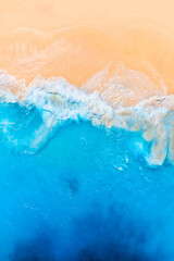 Wall Mural - waves and beach from a drone. aerial landscape. blue water background from drone. summer seascape fr