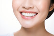 © Nico Vincentini - A close-up shot of the lower portion of a woman's face. She boasts a lovely, charming smile with immaculate teeth. Features include her chin, nose, and mouth. Ideal for dental service promotions. AI