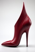 A Red High Heeled Shoe With A Pointed Toe. Generative AI Image.