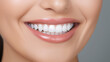 © Nico Vincentini - A close-up shot of the lower portion of a woman's face. She boasts a lovely, charming smile with immaculate teeth. Features include her chin, nose, and mouth. Ideal for dental service promotions. AI