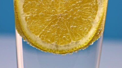 Wall Mural - macro shot of pouring water making tiny air bubbles under carbonated water