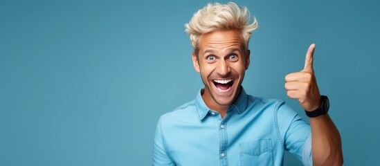 Poster - Happy adult male pointing and smiling indicating object in open area