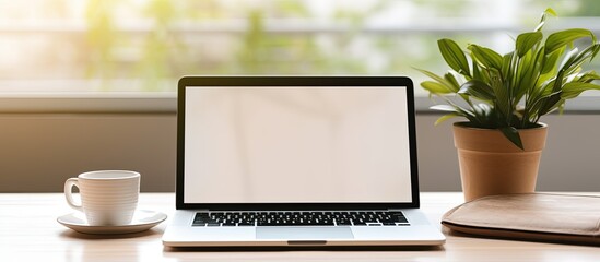 Wall Mural - Woman typing on laptop with blank screen Working from home concept with copy space area