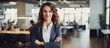 © HN Works - Smiling Caucasian woman manager in suit with folded arms surveys open area in contemporary office Professional lifestyle occupation advertisement and oppo