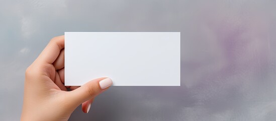 Poster - Caucasian woman with business card on grey background