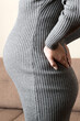 © sosiukin - Pregnant woman hold back pain on sofa at thr home. Maternity healthcare concept support products