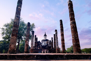 Canvas Print - Sukhothai Wat Mahathat Buddha statues at Wat Mahathat ancient capital of Sukhothai Thailand. Sukhothai Historical Park is the UNESCO world heritage