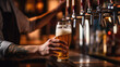 © EmmaStock - close-up hands of bartender opening pouring a beer from the tap