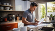 © Studio Nova - Man deals with paying bills at the end of the month in his kitchen. Created with Generative AI technology.