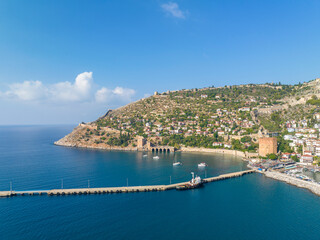 Wall Mural - Alanya - Turkey, August 11, 2023, An aerial view of the bay Alanya in Antalya Turkey. Sea and city with an open sky. Kizil Kule - Alanya