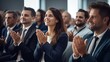 © VERTEX SPACE - Happy colleagues applauding while sitting in conference event at convention center business people sit together in convention hall listen seminar success clapping happiness,ai generate