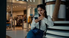 Female Student Middle-eastern Girl Businesswoman Arabian Ethnic Woman Student Shopper Chatting On Phone Sit At Shopping Center Use Mobile Apps Purchasing Online Read Digital News Watch Internet Video