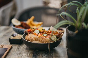 Wall Mural - Rice with chicken and vegetables in a bowl in a restaurant