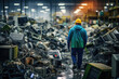 Worker In The Background Electronics Recycling Plant. How Electronics Recycling Works, Benefits And Risks Of Electronics Recycling, Working Conditions In Recycling Plant